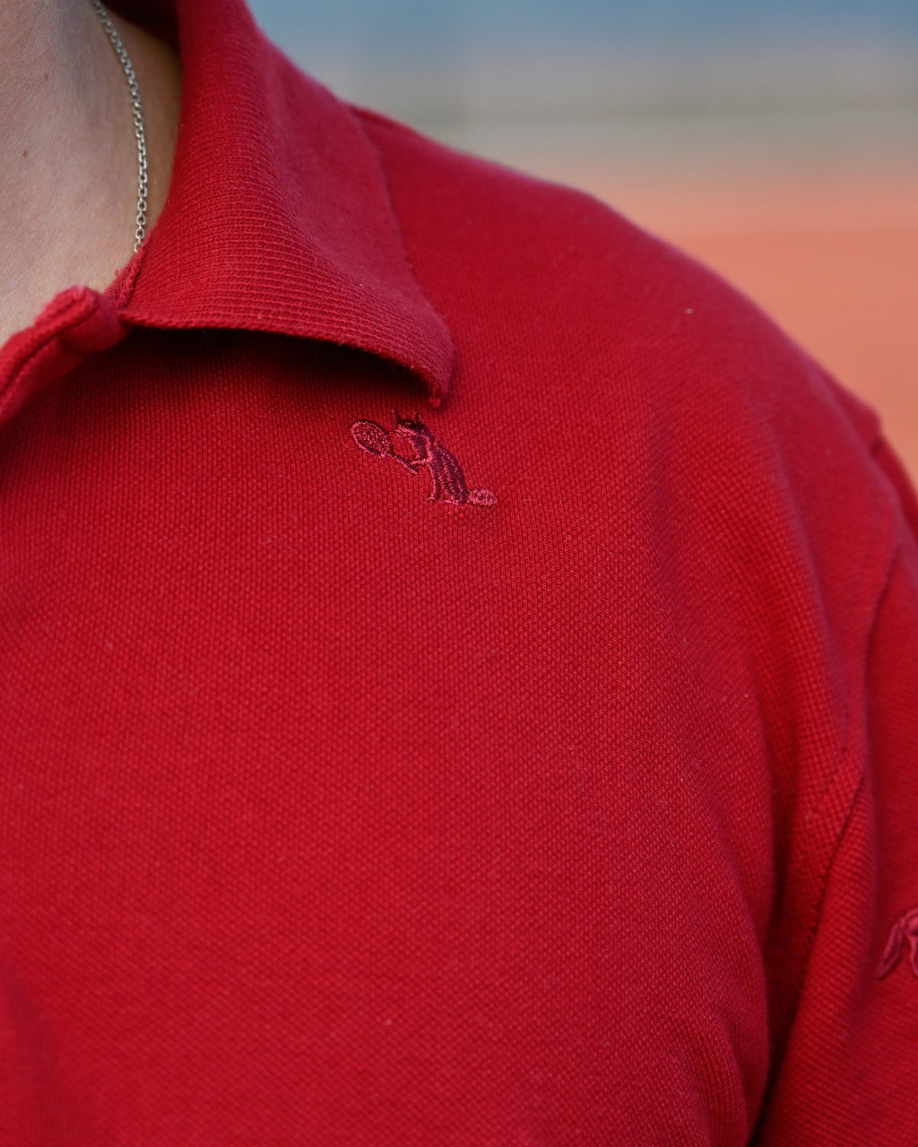 A single fox stitched beneath the collar